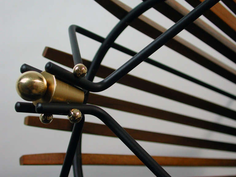 Beautiful mid century modern umbrella stand made of teak, black lacquered metal and brass details.