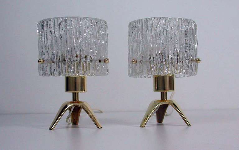 Beautiful pair 1950s brass & textured ice glass table or bedside lamps, made by Kalmar Vienna. 
The lamps require E14 screw on bulbs and work on 110V as well as 220V. They have got Continental Eurpoean 2-pin plugs but can also be delivered with