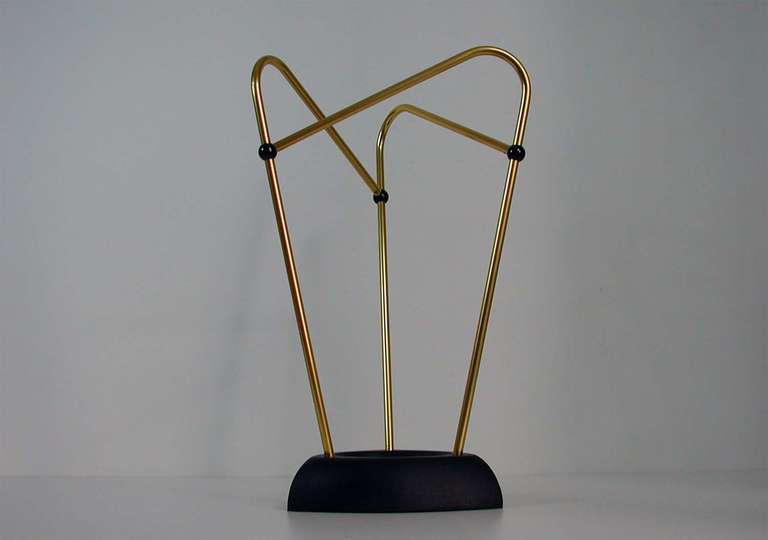 High style Italian asymetric triangle Mid century umbrella stand. 
A truely stylish and very chic piece from the 1950s.
Made of gold anodized aluminum and black plastic balls.
The base heavy black lacquered cast iron.
Condition is extremely good