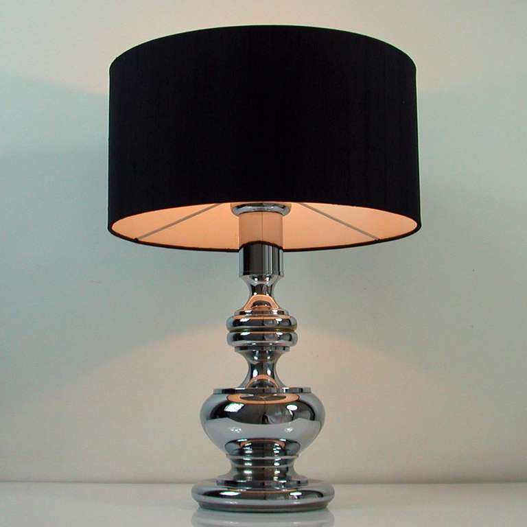 Large chrome bubble table or desk lamp, made in Germany in the late 1960s-early 1970s. 

The lamp has got a E27 Edison screw on socket and works on 220V as well as 110V. The black silk lamp shade is new.