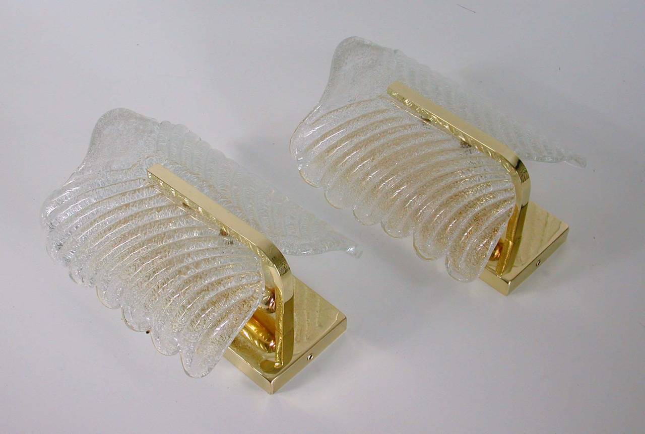 Awesome pair of textured Murano ice glass and brass sconces.
Both suitable for US use. They require a E17 screw on bulb each.