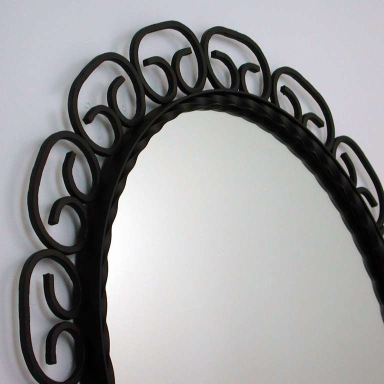 Beautiful wrought iron French wall mirror.
Total diameter is 25