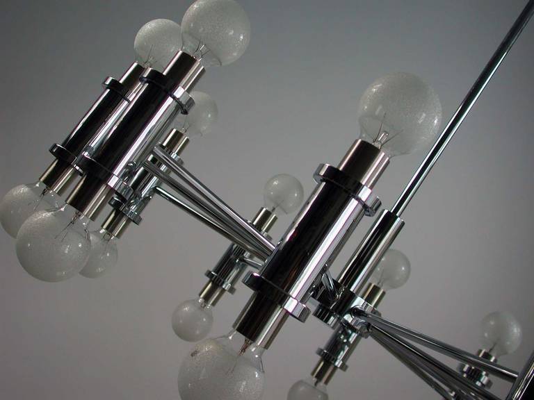 Awesome 1970s Italian 20 light chrome chandelier attributed to Gaetano Sciolari.

Excellent condition. 

The chandelier requires 20 E17 Edison screw on bulbs and works on 220V as well as 110V. The lamp has got textured bulbs. Shipping is with
