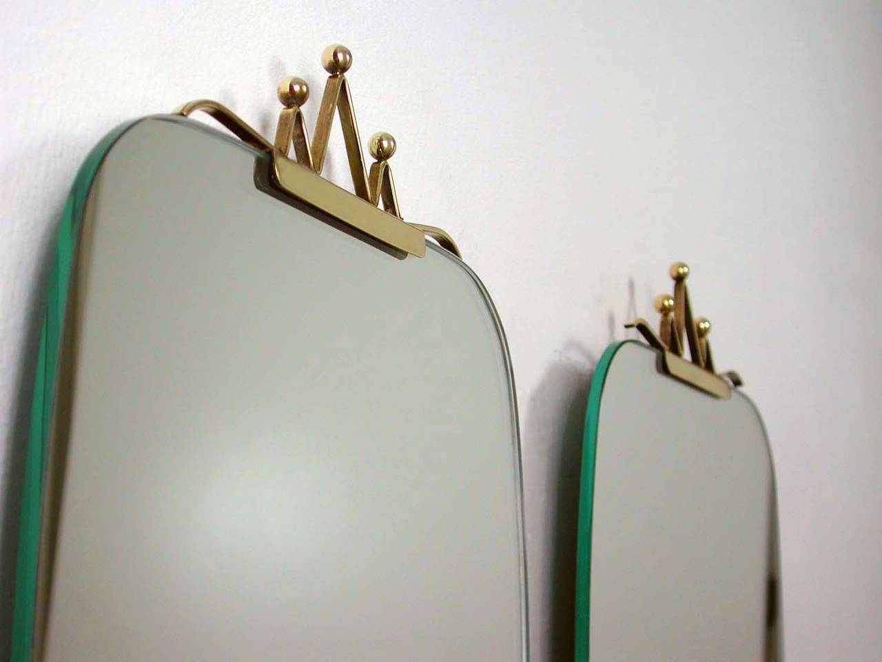 Beautiful pair of very elegant 1950s Italian wall mirrors with brass details.
Excellent vintage condition. 
Price is per piece (for one mirror).