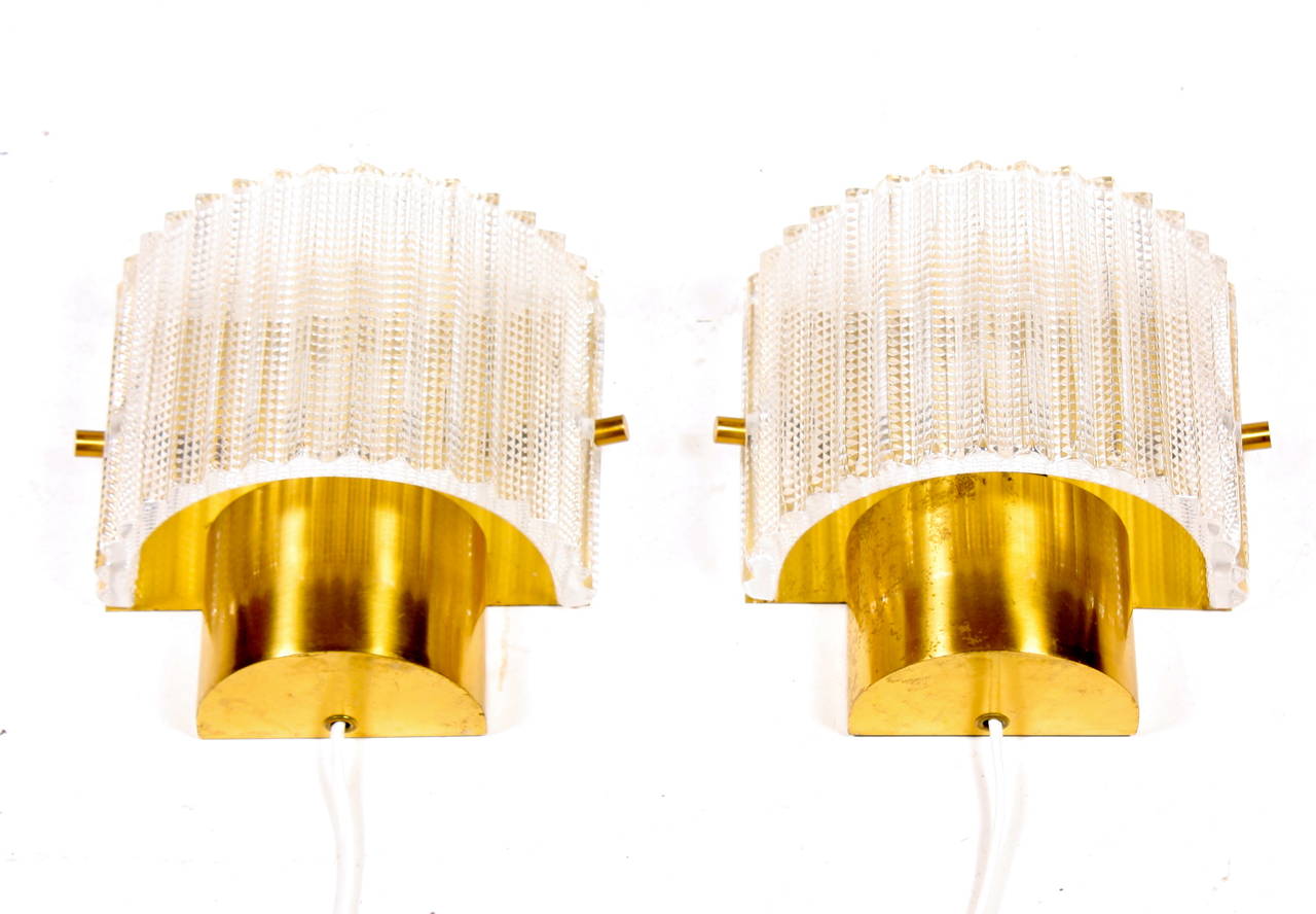 Great looking pair of wall sconces in art glass and brass by LYFA / Orrefors. Made in Denmark in the 1960's. Good condirtion.