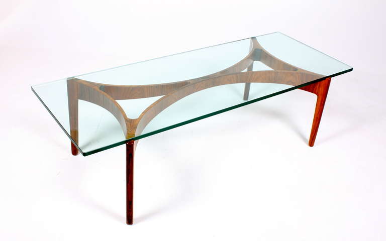 Glass top table on a rosewood base. Designed by Svend Ellekjaer, Great original condition.  Made by Chr. Linnebjerg cabinetmakers - Denmark 1950s