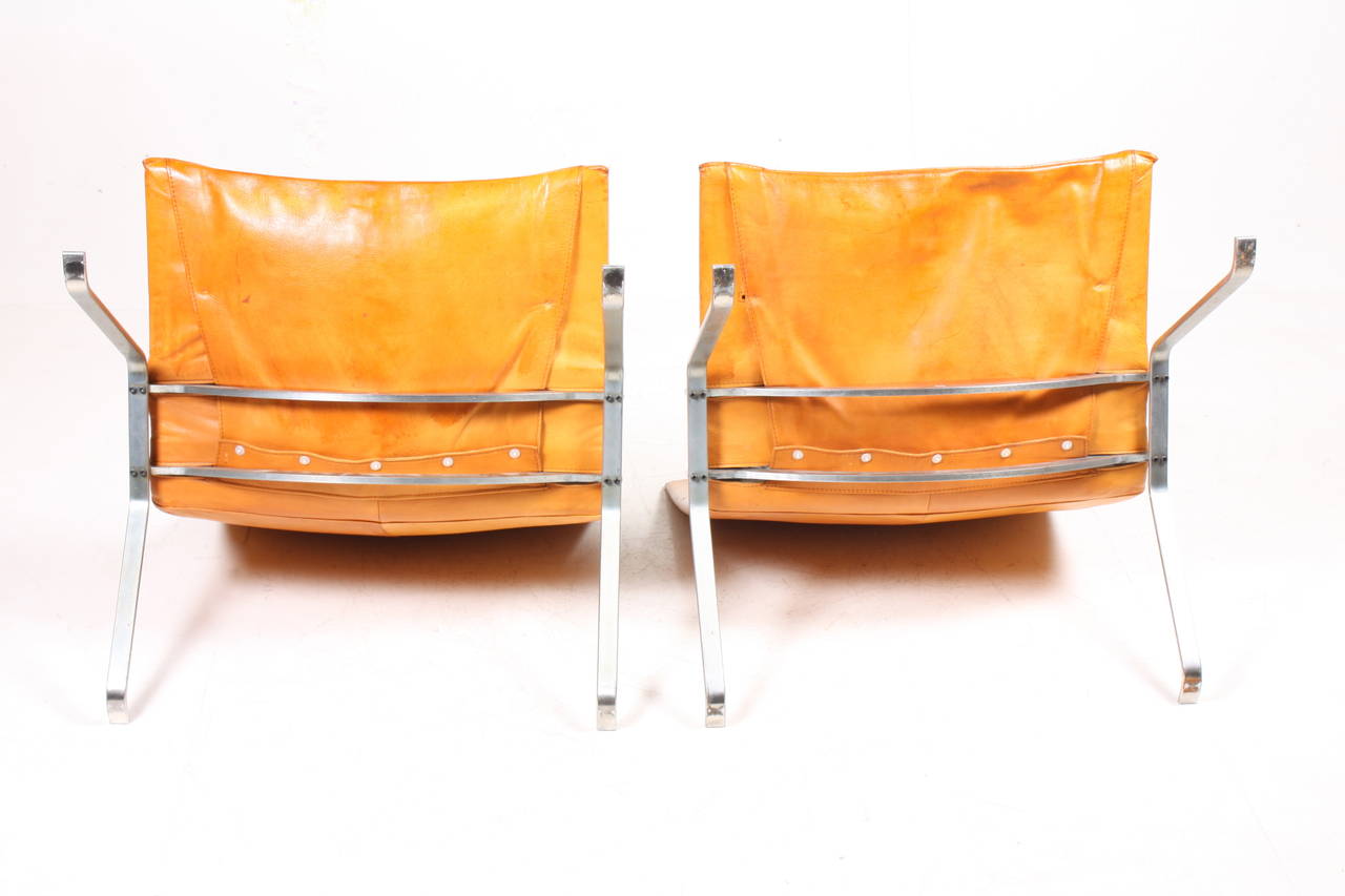 Pair of PK 22 easy chairs in patinated leather - Out standing patina and color. Designed by Poul Kjærholm and made by Kold Christensen Denmark in the 1960's - Original condition.