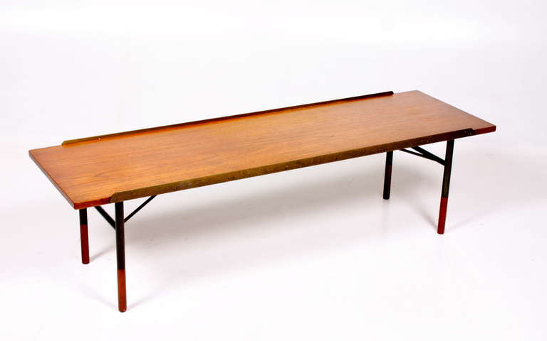 Bench in teak on a base of gun plated metal. Designed by Maa Finn Juhl and edited by Bovirke. Danish, 1950s. Great Original condition.