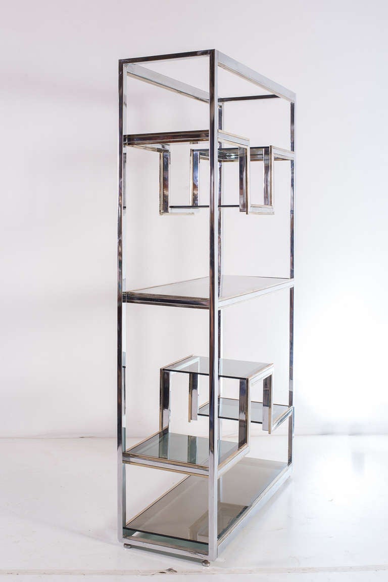 etagere by Romeo Rega, in perfect conditions, made by steel and brass structure, with glasses .