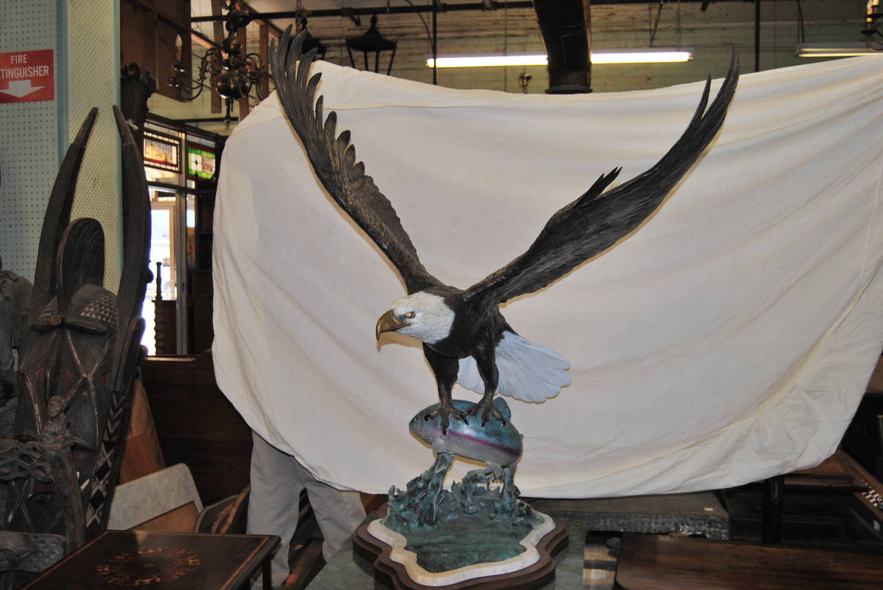 This is a bronze sculpture of an eagle catching a rainbow trout in its talons. It is done the a world-renowned American Wildlife artist, Ron Leep. The detail on this piece of art is truly amazing. Please go to Ron Leep's web page to read all of the