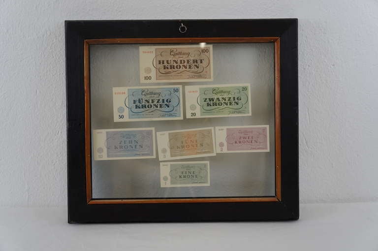 Money form the Jewish Ghetto Theresienstadt at the second World War. The money is inside a glas frame.