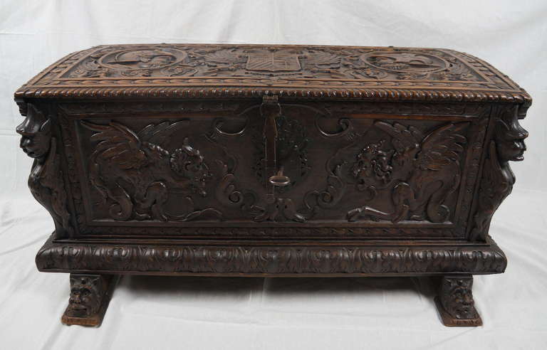 Wonderful oak coffer from the 17th century. The whole coffer is carved whit mannerism figures. On the top the coffer shows an eagle with a coat of arms and 2 knights looking on it. The lock, the key and also the metal handles on the side are