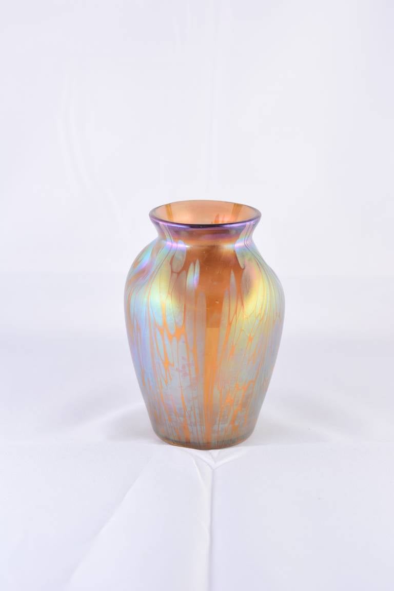 This vase is beautiful example of a creation of Loetz with the Medici decoration. The Medici decoration genre was invented in the year 1902. Silberkröselzungen were applied on different colours of foundations which were iridescent by themselves.