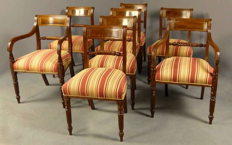 Fine set of 8 mahogany dining chairs including two armchairs dating to the Regency period of England, characteristically called 