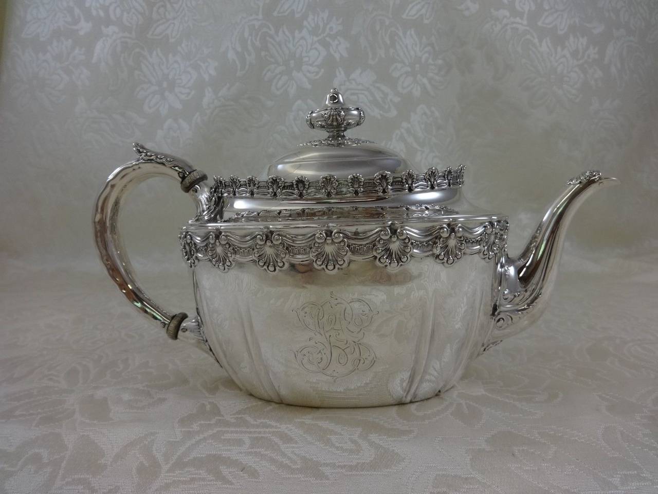 This exceptional English King by Tiffany & Co. Sterling Silver FOUR PIECE TEA SET with kettle on stand INCLUDES:

    HOT WATER KETTLE ON STAND, 13 1/2