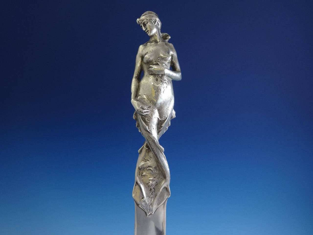 Whiting.

Sterling silver beautiful Art Nouveau cast 3-D figural page turner/paper knife by Whiting. This is a superb piece weighing over 14 troy ounces and measuring almost 18” long. This impressive piece features an Art Nouveau nude mermaid in