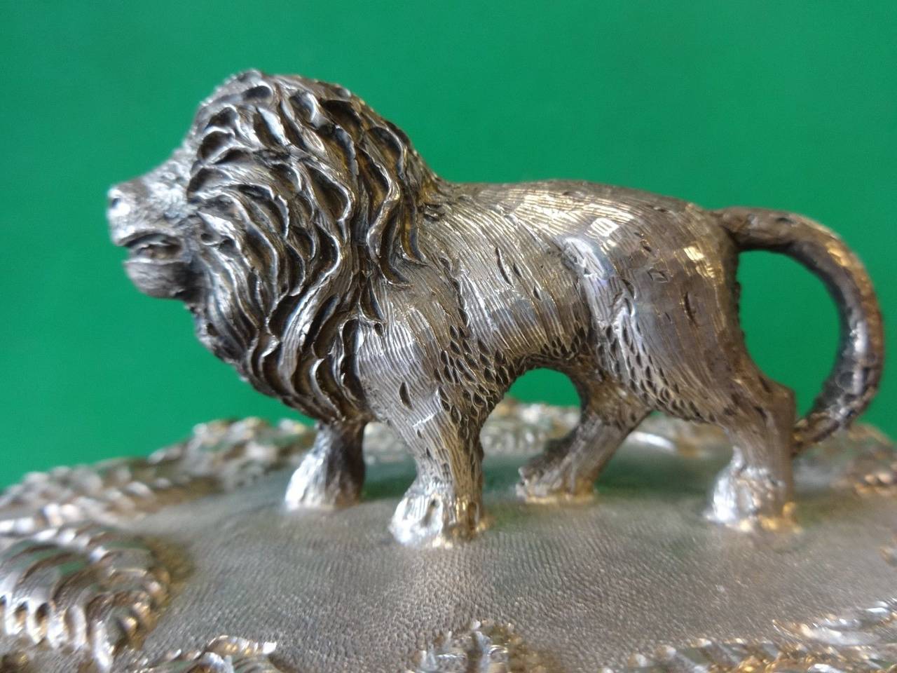 Impressive Baltimore rose by Schofield casserole dish with cover featuring an applied 3-D lion. The piece has the original ironstone liner. There is a repoussed monogram worked into the design that reads 