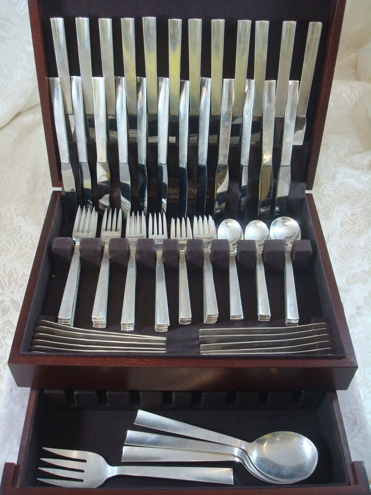 Harry Osaki (Pasadena, CA, circa 1960s) trained with Allan Adler and learned the trade of creating fine hand-wrought silver from Porter Blanchard. He made some of the finest hand-wrought silver of all time. Osaki silver flatware is quite scarce. The