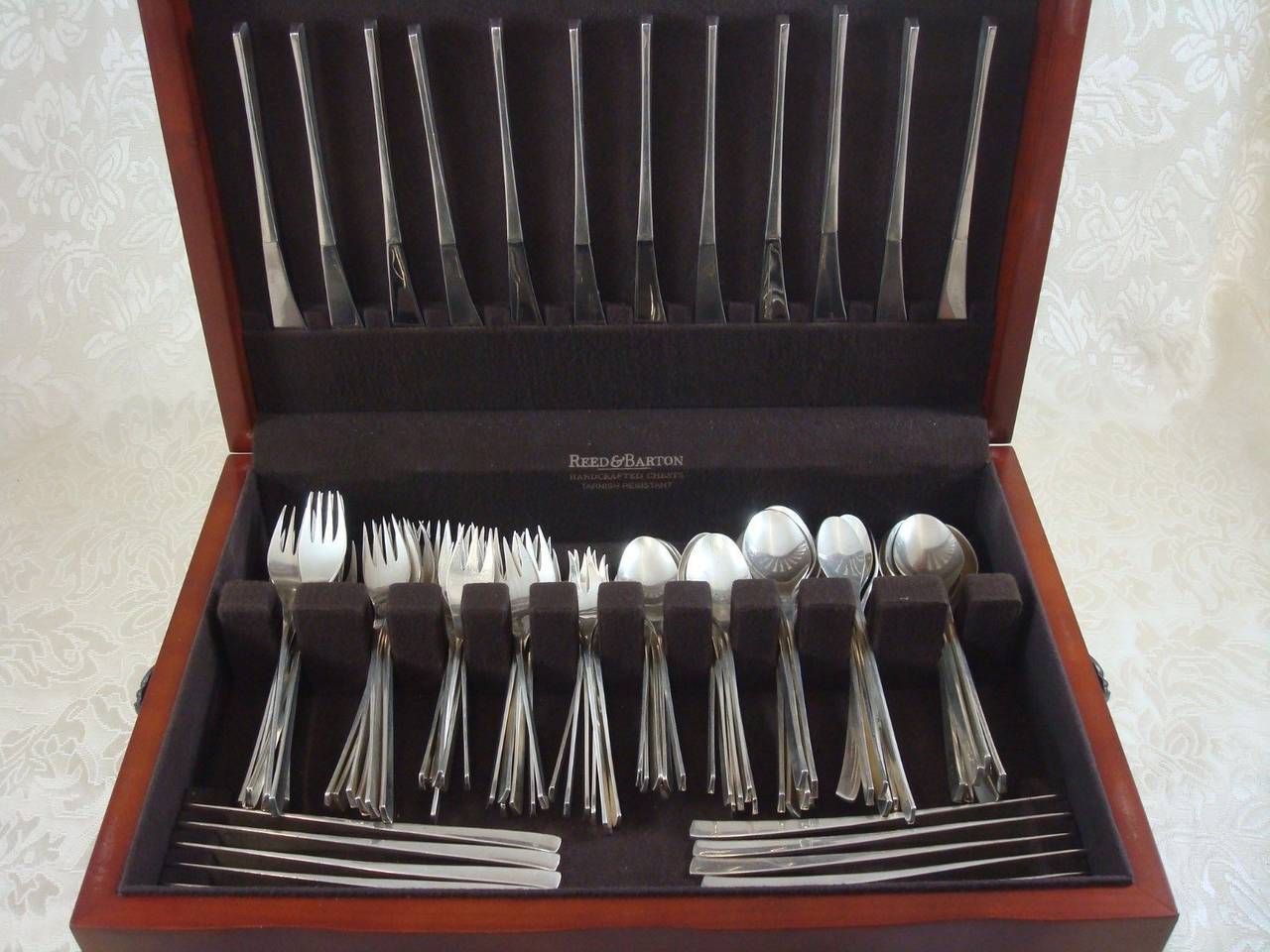 A set for 12 vintage International sterling flatware in the pattern Vision designed by Ronald Hayes Pearson patented in 1961. This discontinued pattern features clean, Modernisn inspired lines and is featured in the book 