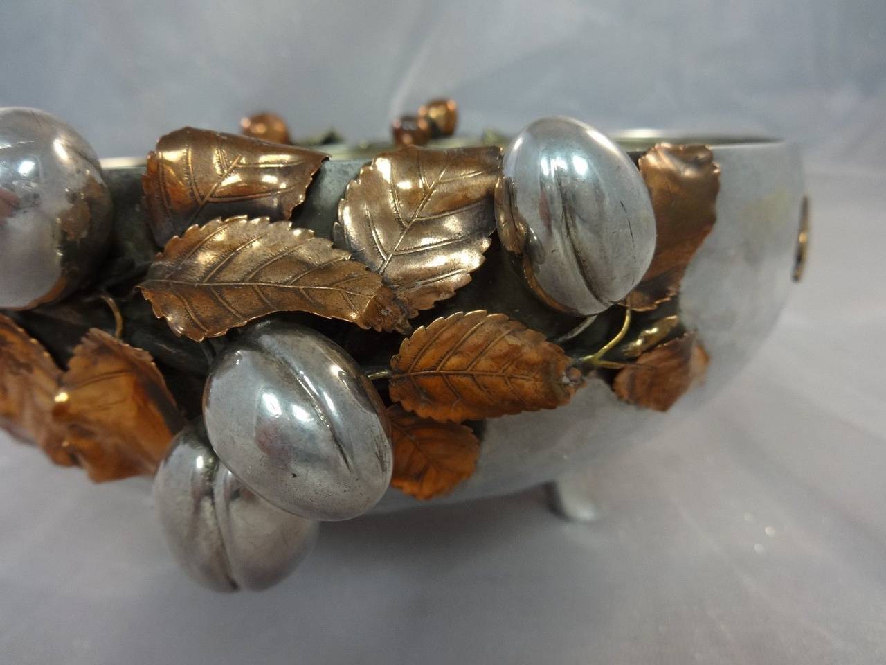 MIXED METALS BY GORHAM

Fabulous Sterling Silver BOWL FOOTED WITH APPLIED STERLING AND COPPER FRUITS, GILT AND COPPER REALISTIC 3-D LEAVES, COPPER ROOSTER, COPPER SWALLOW, AND BUTTERFLY 8 3/8