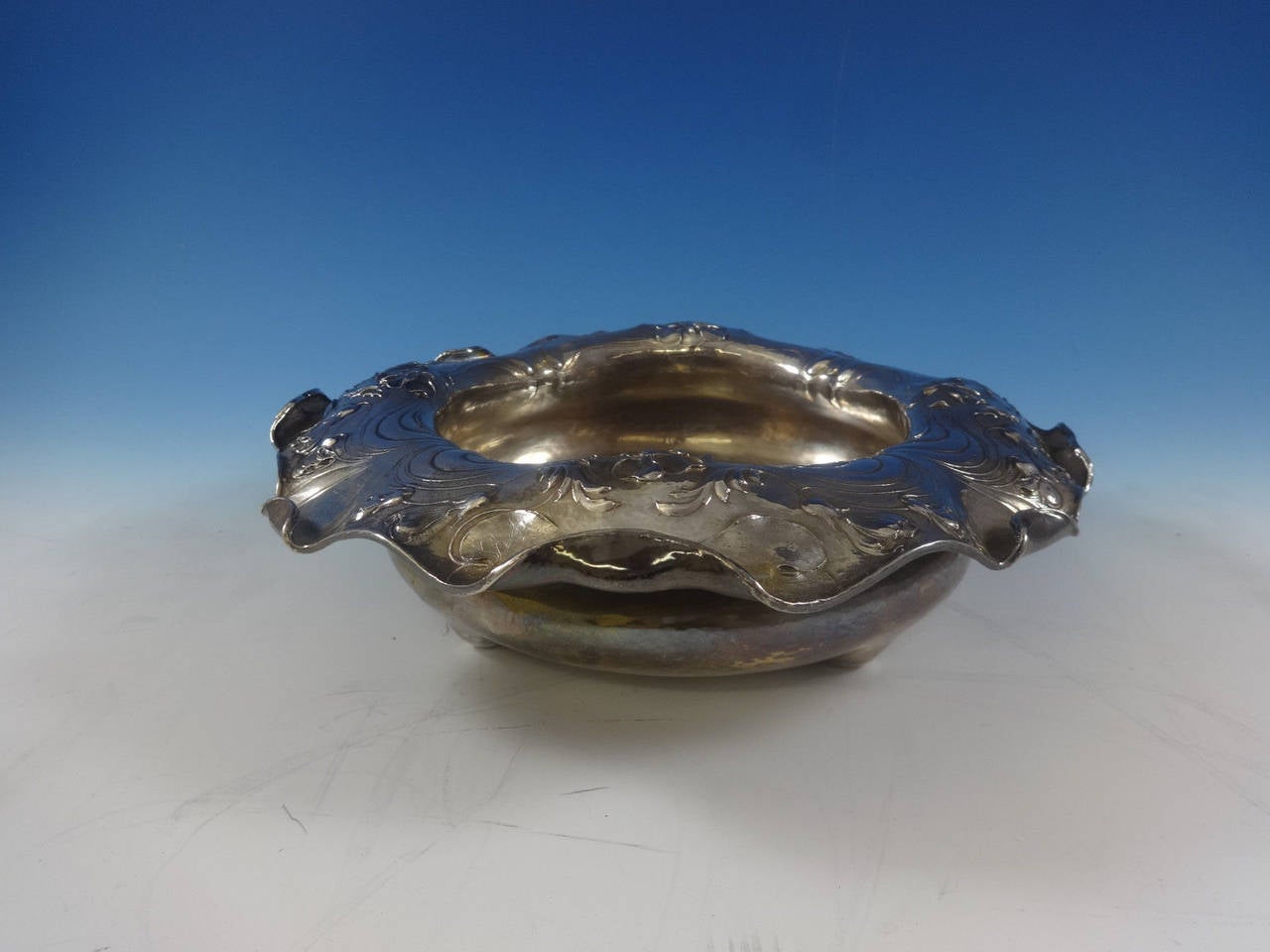Martele by Gorham
 Art Nouveau Martele by Gorham .950 sterling silver round salad or berry bowl with beautiful floral motif and wide ruffled rim, #FR. It was made in December of 1900, took 23 hours to form, and was hand chased for 58 hours. The hand