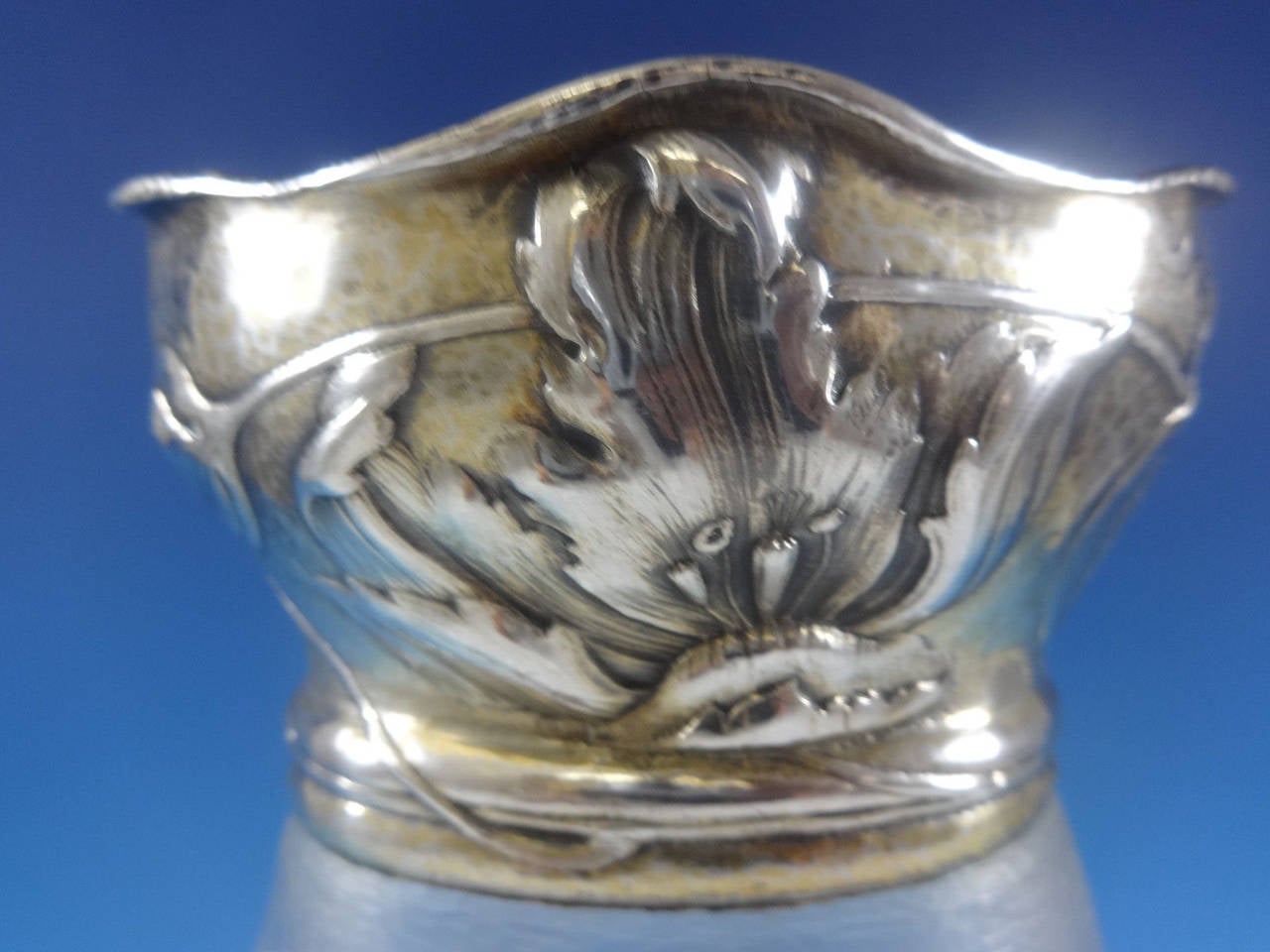 Martele By Gorham.
Art Nouveau martele by Gorham .9584 sterling silver mounted etched French glass vase with beautiful floral motif. It was made in September of 1905, took 16 hours to form, and was chased for 20 hours. It measures 13 1/2