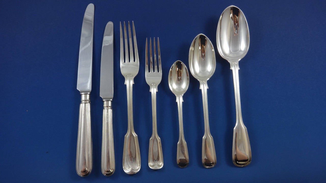 Sterling silver flatware set for 12 in the fiddle thread pattern. Made by George Adams, one of the premier English flatware makers.

Exceptional fiddle thread by George Adams English sterling silver flatware set of 85 pieces. This set
