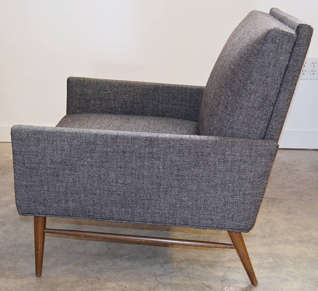 Sleek lined early McCobb club chair in original fabric, charcoal tweed.