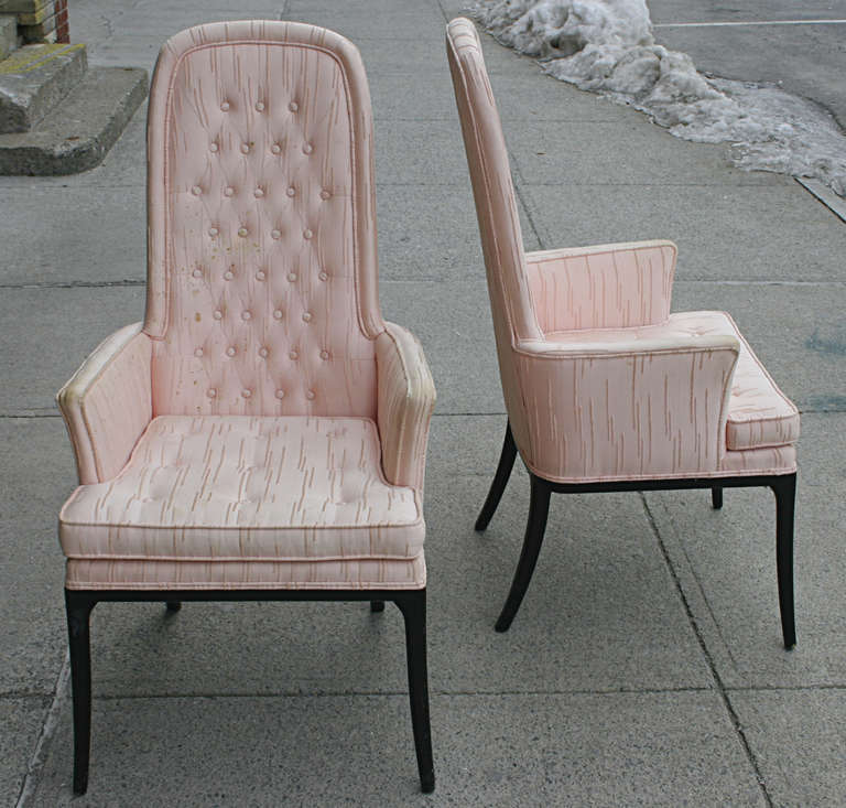 Elegant high back tufted armchair by Erwin-Lambeth. Original pale pink fabric with tufted back and seat cushion sit atop black saber legs. fabric need replacing or major cleaning.