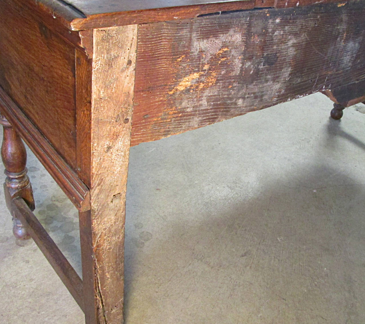 19th century English oak server. Geometric molded two-drawer case on turned front legs and square rear legs with stretchers. Original drop pulls and locks, no key.