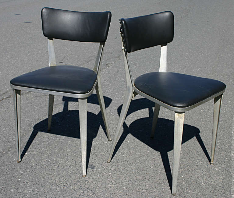 Award wining chair by English Designer, Ernest Race. The BA3 side chair is an all aluminum frame with vinyl upholstery. Originally designed in 1946 using all recycled materials made into parts easy to assemble and ship. This set most likely was born