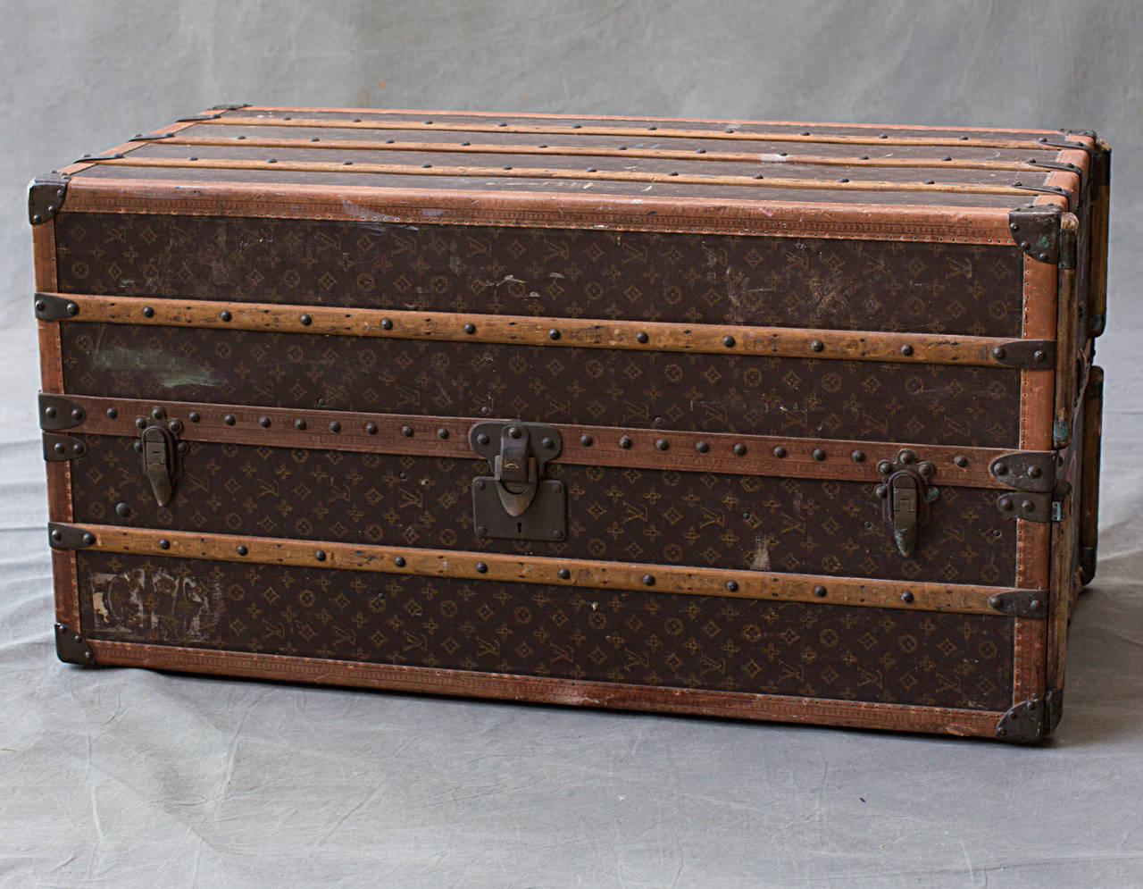 Single family owned wardrobe originally purchased in Paris in 1924. This incredible trunk has made several voyages across the Atlantic with its last in 1974. Interior retains original trays, removable case, hangers, and dust cover. Interior canvas