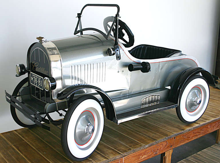 Early 20th century Cadillac pedal car restored late 20th century. Heavy steel construction in full working order. Larger scale.