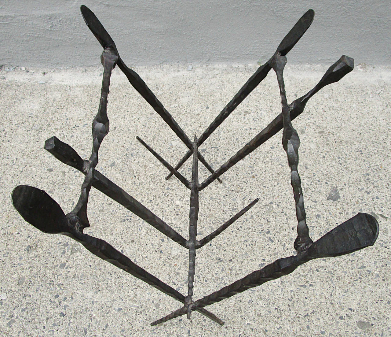 Hand forged steel brutalist magazine rack. Warm dark bronze patina.