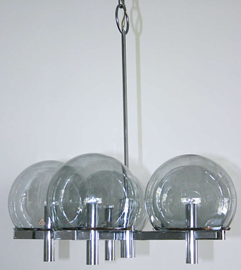 Classic Sciolari. Five arm flat bar chrome with chrome cylinders at sockets.
exquisite smoke glass globes by French glass maker, Vianne. Retains original ceiling cap. Chandelier is 24