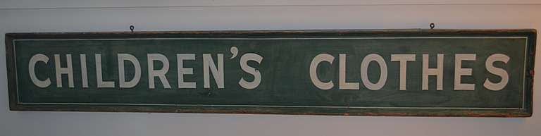 Wooden painted retail store sign 