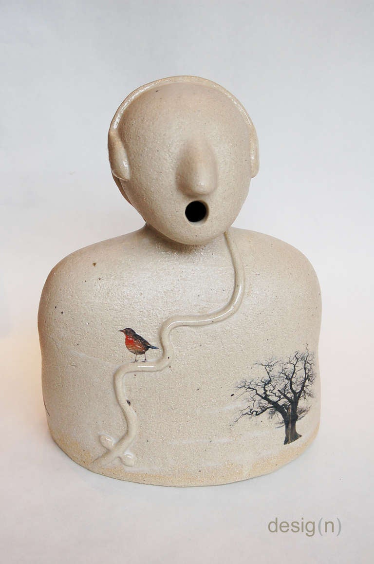 This is a sculpture by Hilde Segers. It is a poetic depiction of a person listening to Nature's music. It has ceramic transfers on its surface depicting animals and trees.
This work is signed and comes with a Certificate of Authenticity.