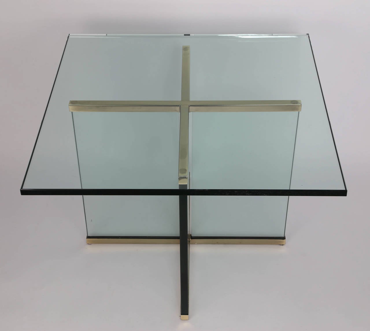 Large end table features an X-shaped base composed of two brass frames securing four slabs of 3/4