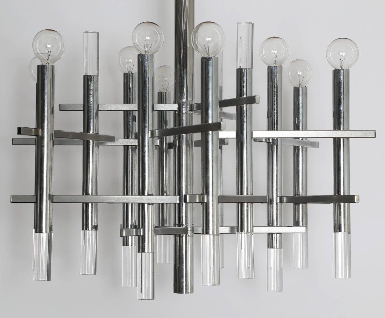 Lovely nine-light chandelier by Gaetano Sciolari features vertical tubes of polished chrome and Lucite connected with horizontal rectangles in brushed chrome. Sciolari label inside original ceiling canopy. Overall height, including chain and
