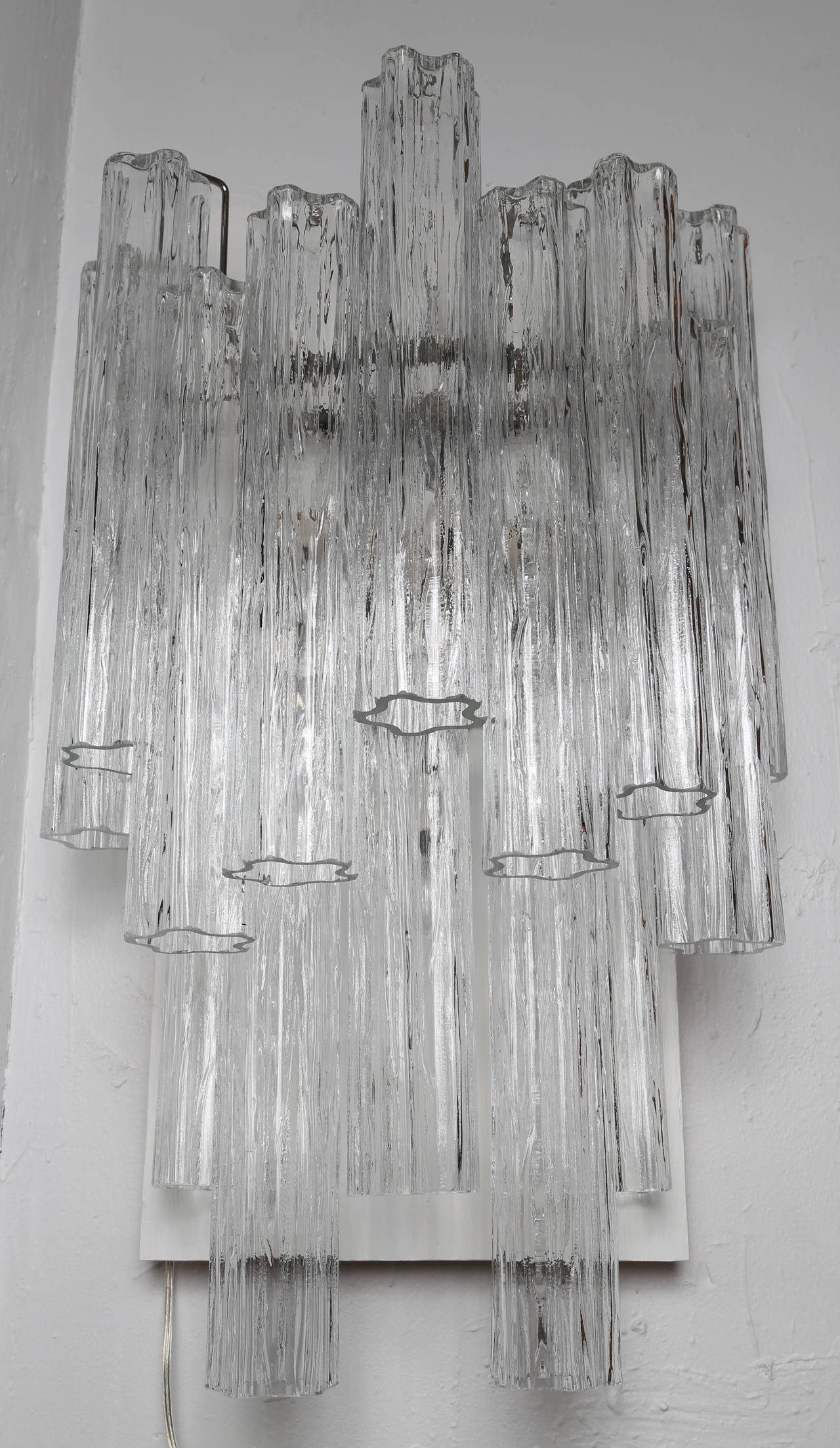 Dramatic sconce features 14 large crystals (three at 12