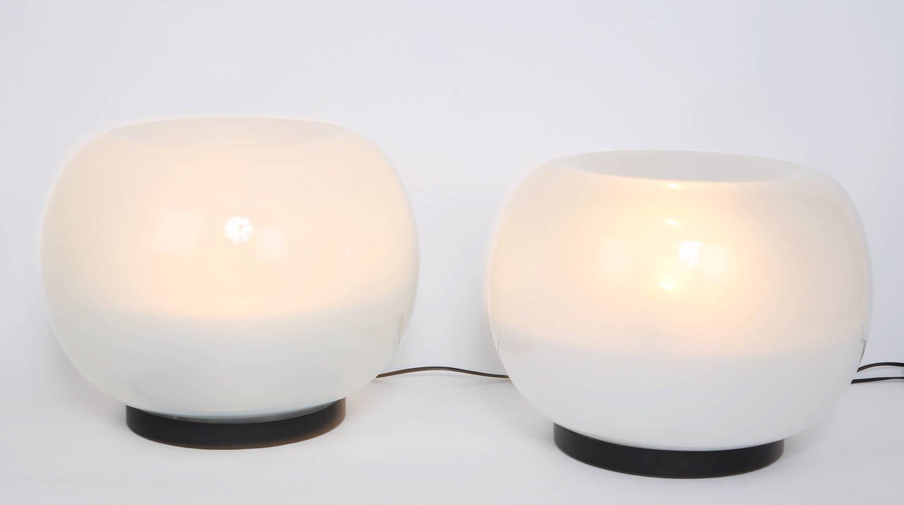 Beautiful pair of orb table lamps by Carla Nason for Mazzega, circa 1960s. Priced at $4,500 for both or $2,250 for a single. The handblown glossy glass transitions from opaque white to a more translucent Frost. Each piece of glass rests on a