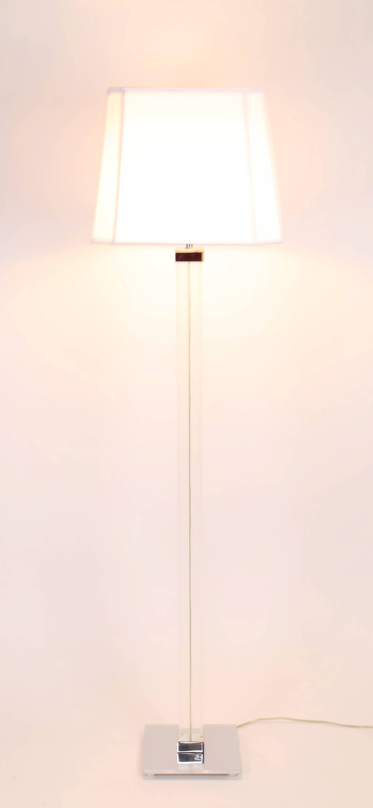 Elegant Karl Springer Lucite and polished nickel floor lamp with a new white linen shade in the exact shape and size as the original shade. Measures: 60