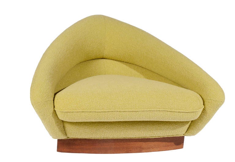 Pair of low-slung lounge chairs by Adrian Pearsall for Craft Associates, reupholstered in Knoll Classic Boucle fabric in chartreuse. Walnut veneer bases refinished. These large chairs, with a sensational triangular shape, will add drama to any room.