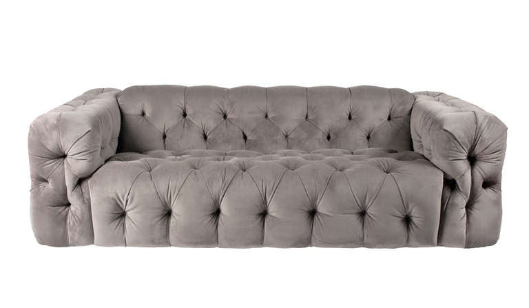 Pair of luscious button-tufted sofas in a modern chesterfield style with dramatic deep backrests and arms. Large-scaled, comfortable. Newly reupholstered in gray velvet. This item is located in our New Jersey warehouse; please give us a few days'