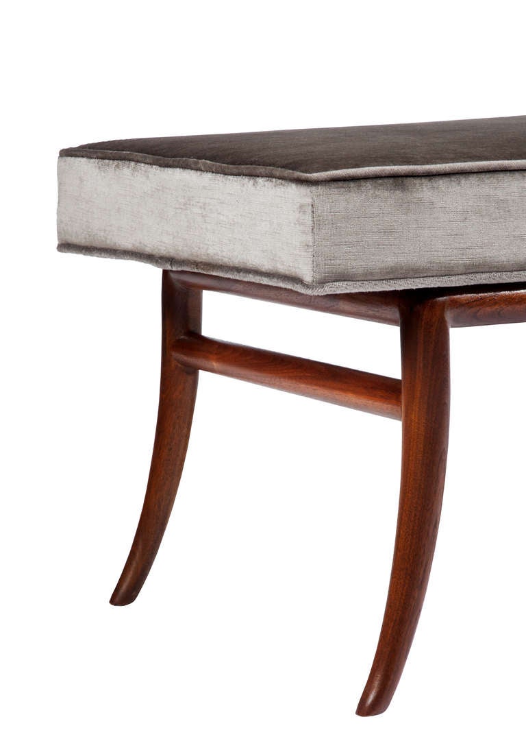 T.H. Robsjohn-Gibbings for Widdicomb sabre-leg bench, mahogany base with new gray vintage-velvet upholstery.