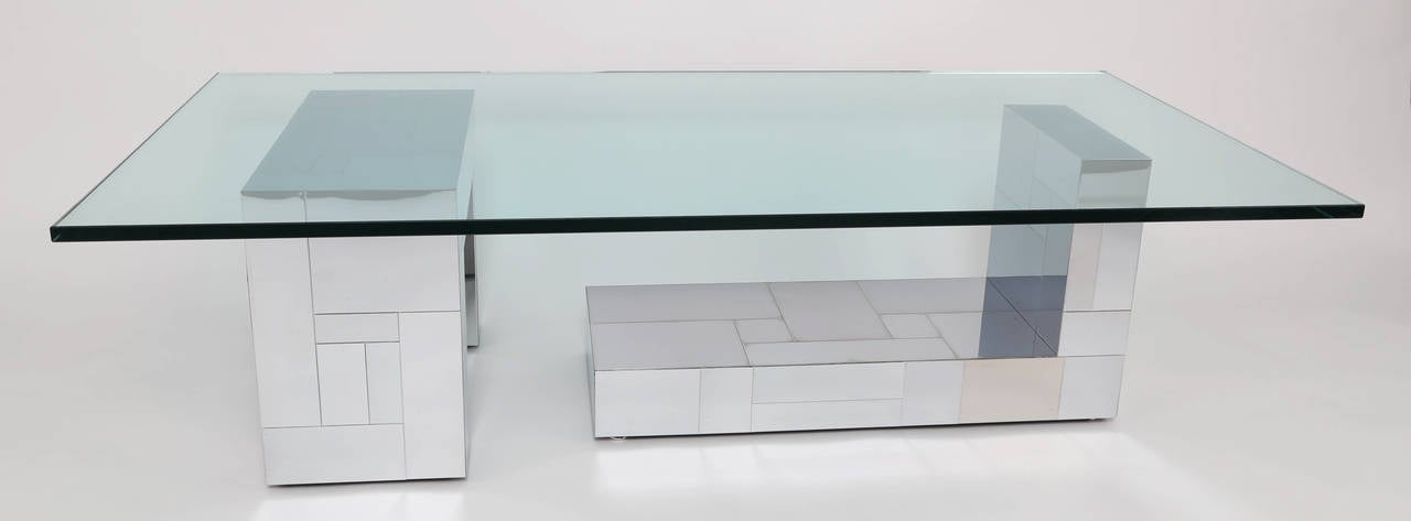 Chic cityscape glass-top cocktail table with two geometric supports. New 3/4