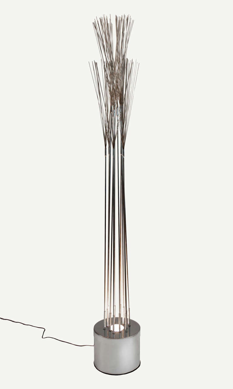 Wonderful 1970s chrome sculptural accent piece, with 12 rods arranged and a circular pattern, topped with Bertoia-style sprays, and lighted from below. C. Jeré/Artisan House. 



