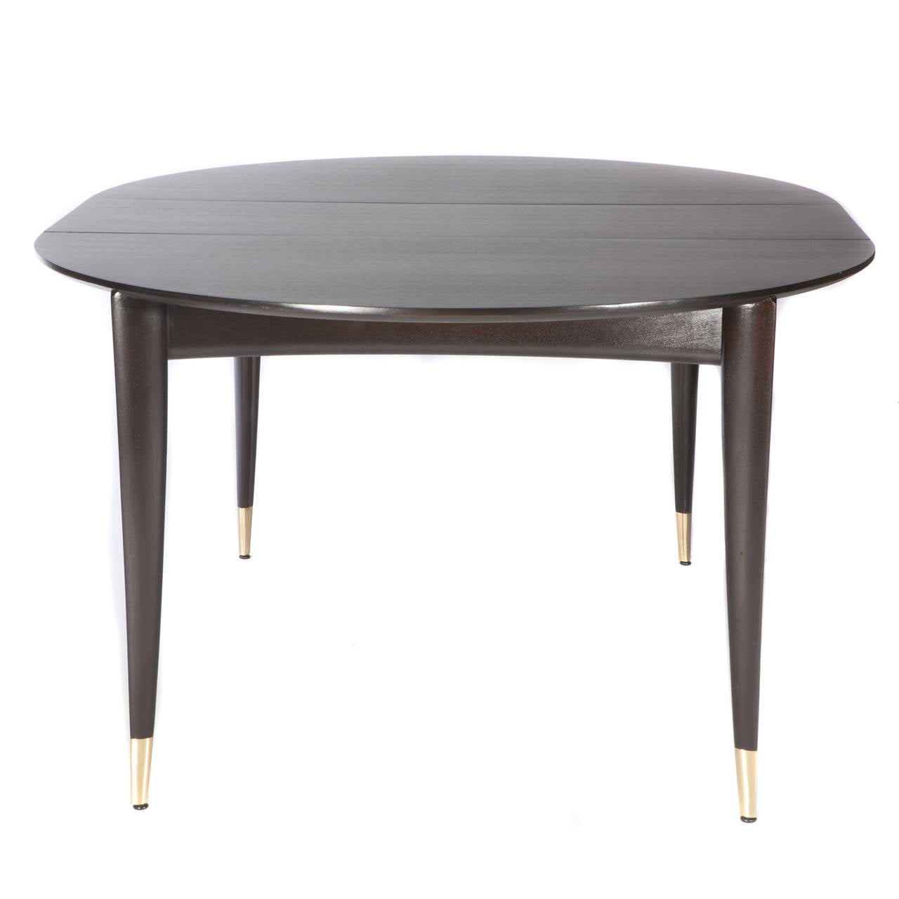 Elegant and Classic Gio Ponti design features tapered legs capped in brass, circa 1950s. A single 14" leaf extends the table to 62". Singer & Sons label. Refinished in a dark chocolate brown. 

See this item in our Brooklyn showroom,