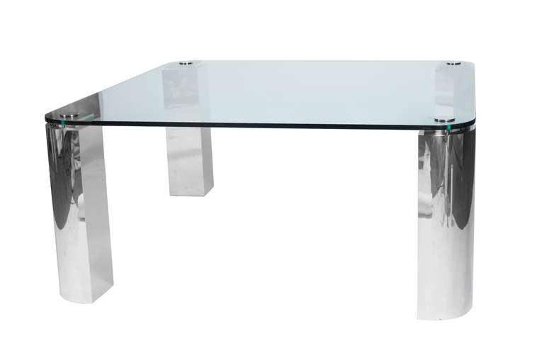 This large, Karl Springer style, square dining table seats eight comfortably. The 3/4-inch-thick glass top attaches with chrome caps to wedge-shaped, steel-wrapped legs with rounded corners. Steel bases are in excellent condition and can be used to