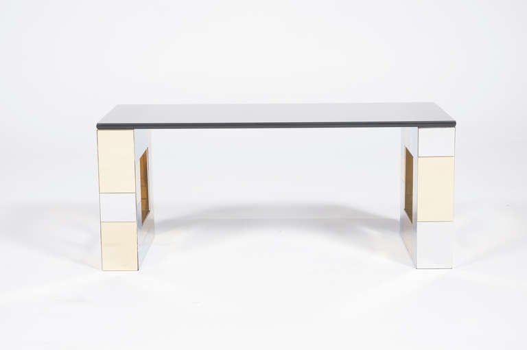 Paul Evans for Directional Cityscape wall-mounted console, polished-brass and chrome-plated steel patchwork cladding, smoked-glass shelf, signed.